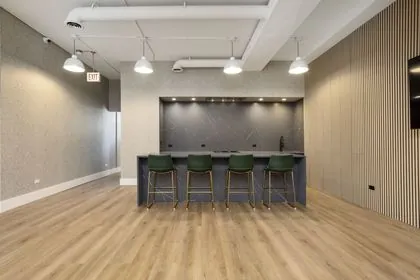 Kitchen island with bar stools at Montrose Studio in Portage Park