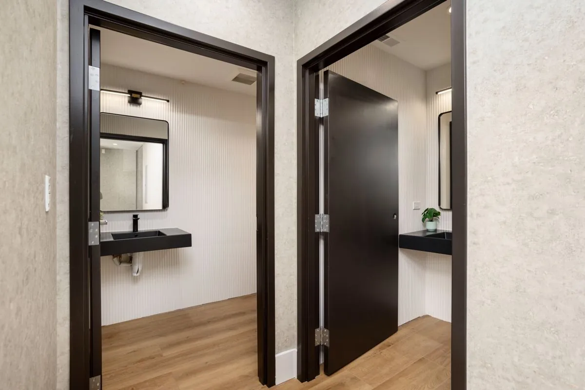 Two unisex ADA-compliant restrooms at Montrose Studio